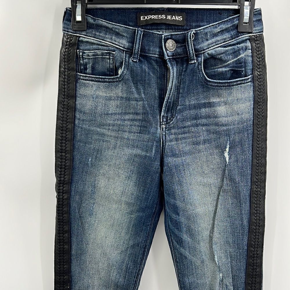 Express Jeans distressed with braided faux leather stripes on outside of legs